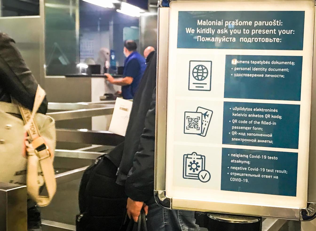 Vilnius, Lithuania, May 16, 2021 - Tourist waiting at a checkpoint in an airport photo