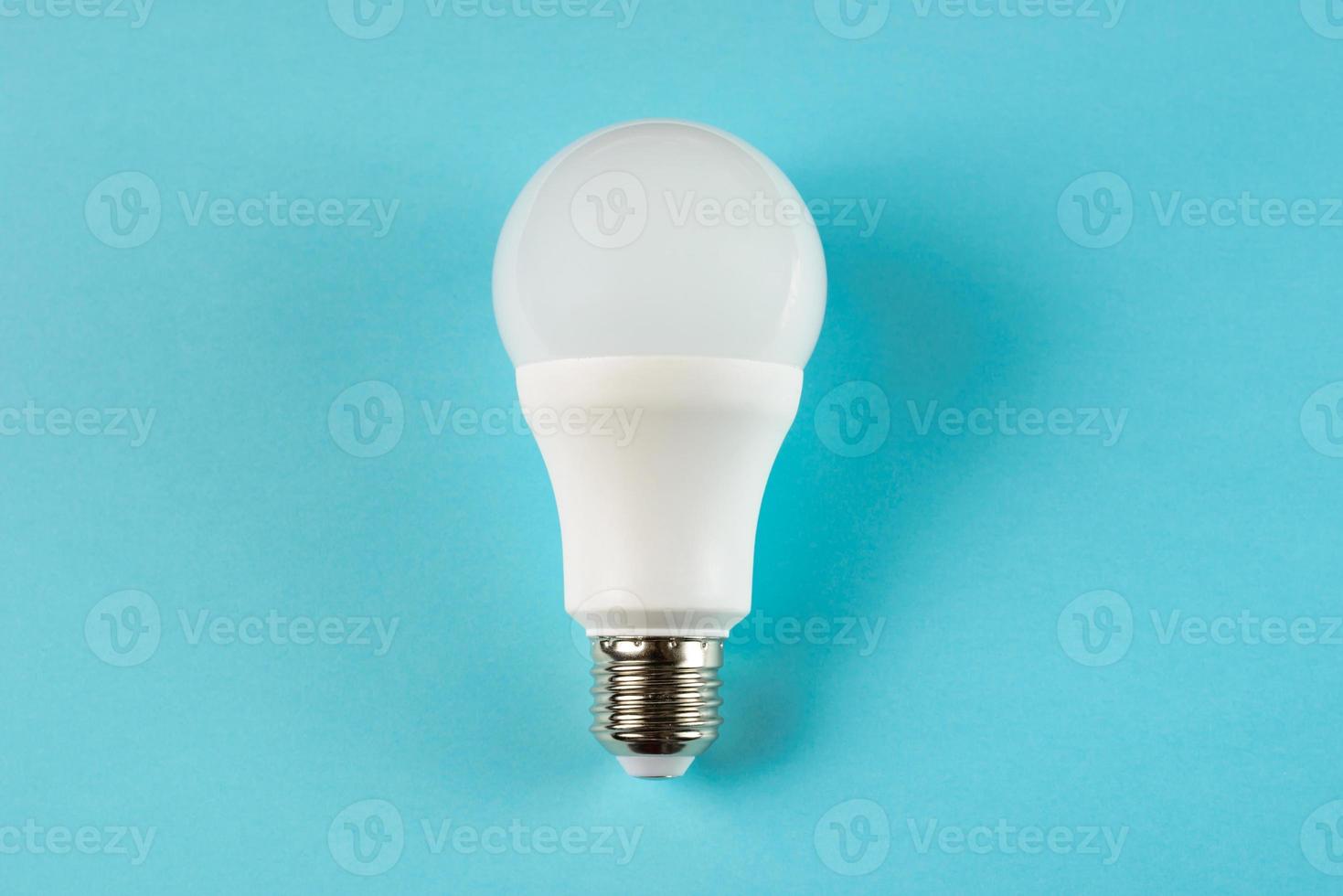 LED light bulb E27 on blue background photo