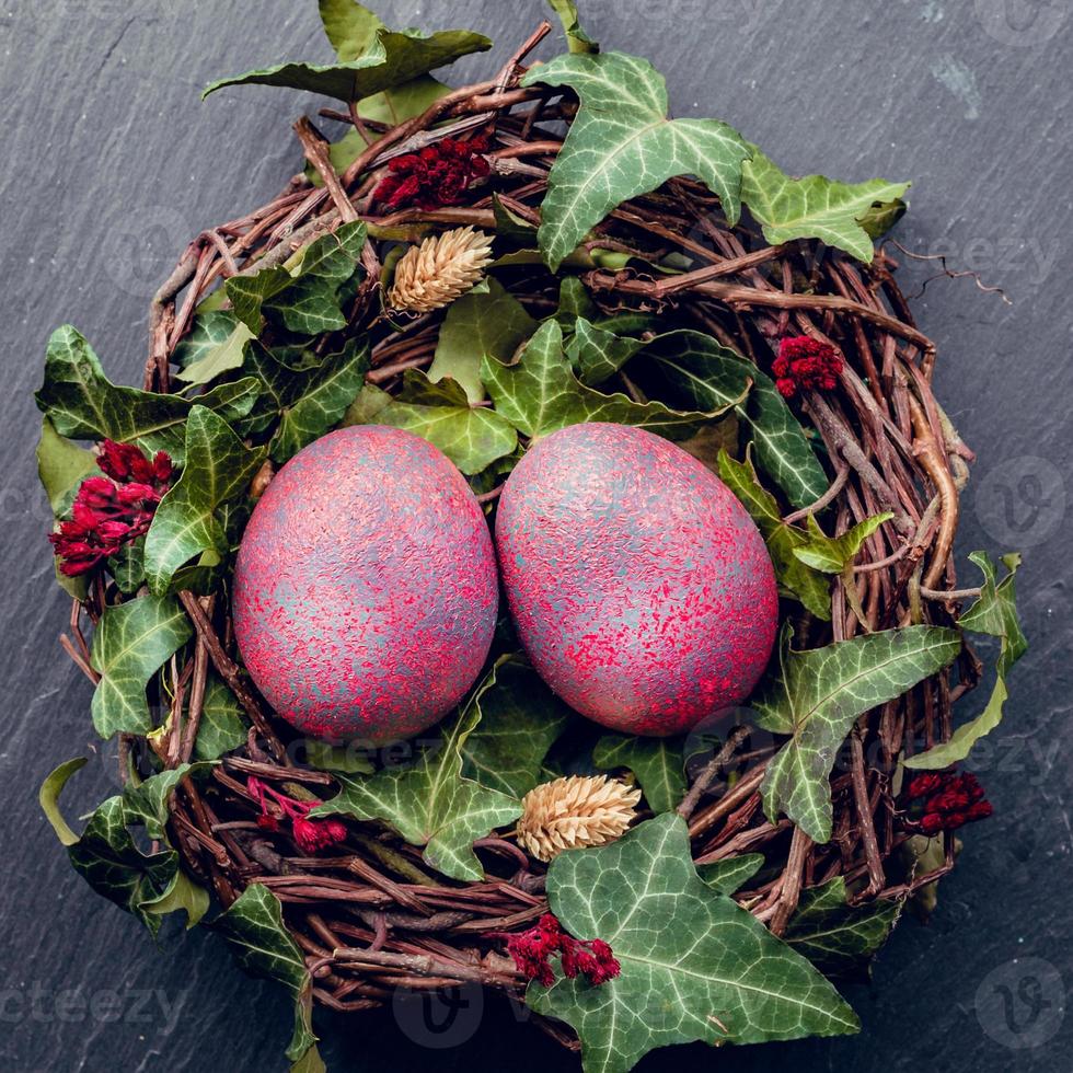 Easter eggs with decoration.Chicken eggs in a birds nest. photo