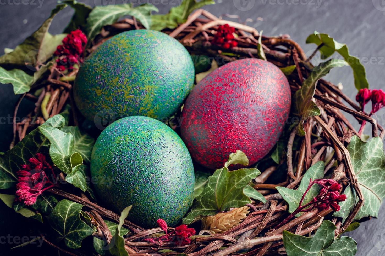 Easter eggs with decoration.Chicken eggs in a birds nest. photo