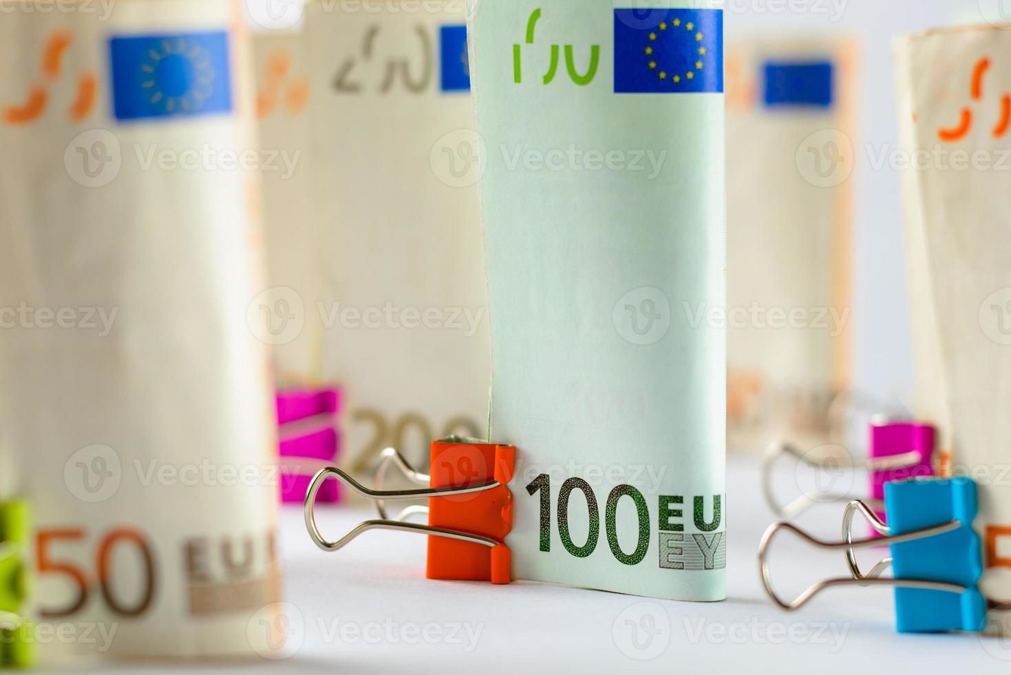 Several hundred euro banknotes. Euro banknotes random stacked. Euro currency money. Banknotes stacked on each other in different positions. photo