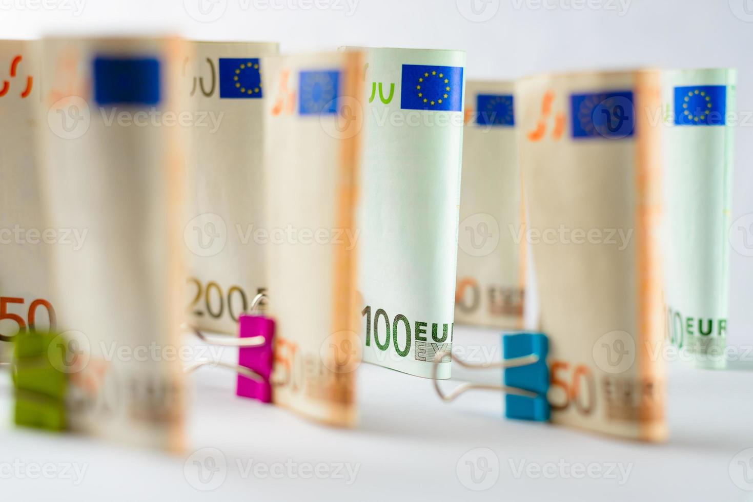Several hundred euro banknotes. Euro banknotes random stacked. Euro currency money. Banknotes stacked on each other in different positions. photo