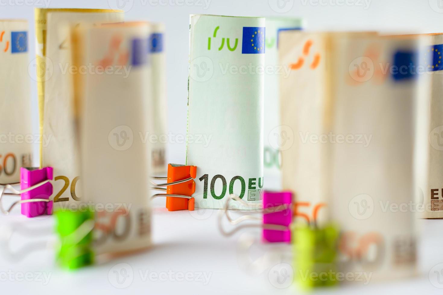 Several hundred euro banknotes. Euro banknotes random stacked. Euro currency money. Banknotes stacked on each other in different positions. photo