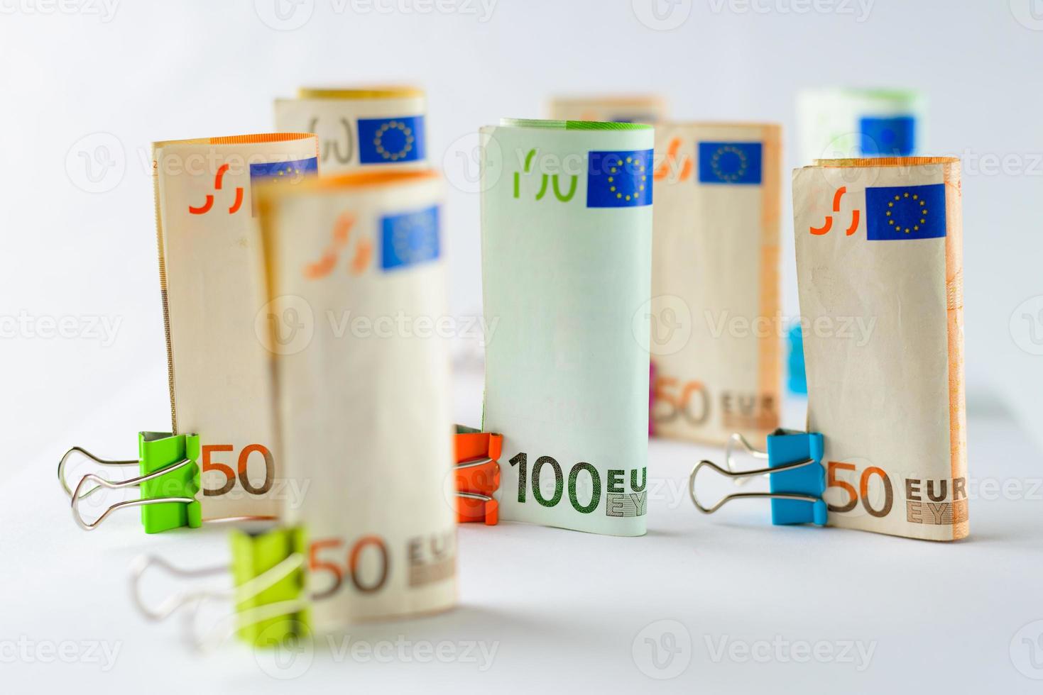 Several hundred euro banknotes. Euro banknotes random stacked. Euro currency money. Banknotes stacked on each other in different positions. photo