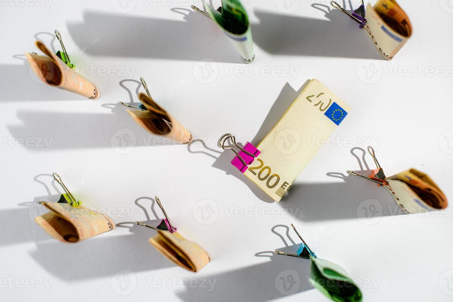 Several hundred euro banknotes. Euro banknotes random stacked. Euro currency money. Banknotes stacked on each other in different positions. photo