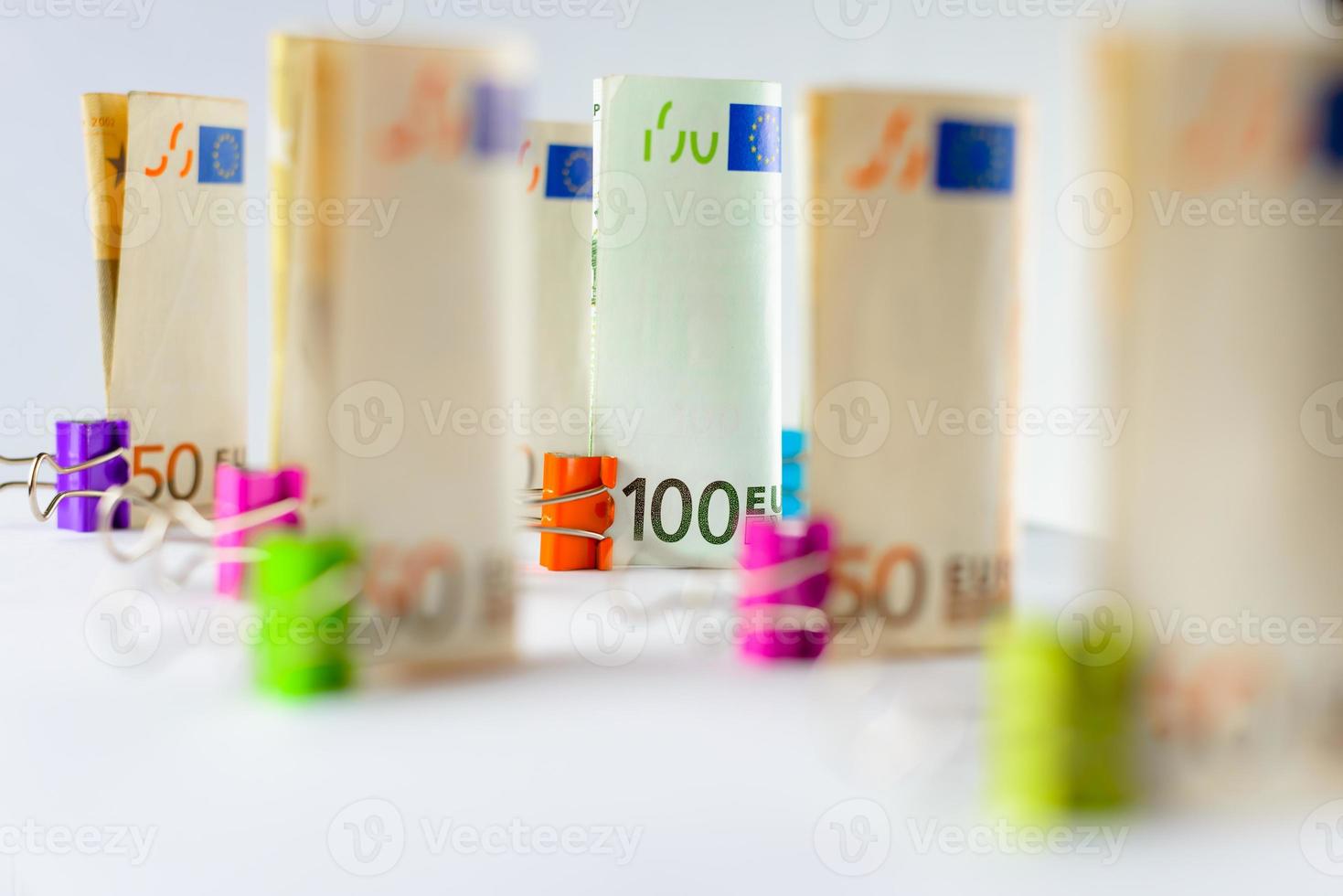 Several hundred euro banknotes. Euro banknotes random stacked. Euro currency money. Banknotes stacked on each other in different positions. photo