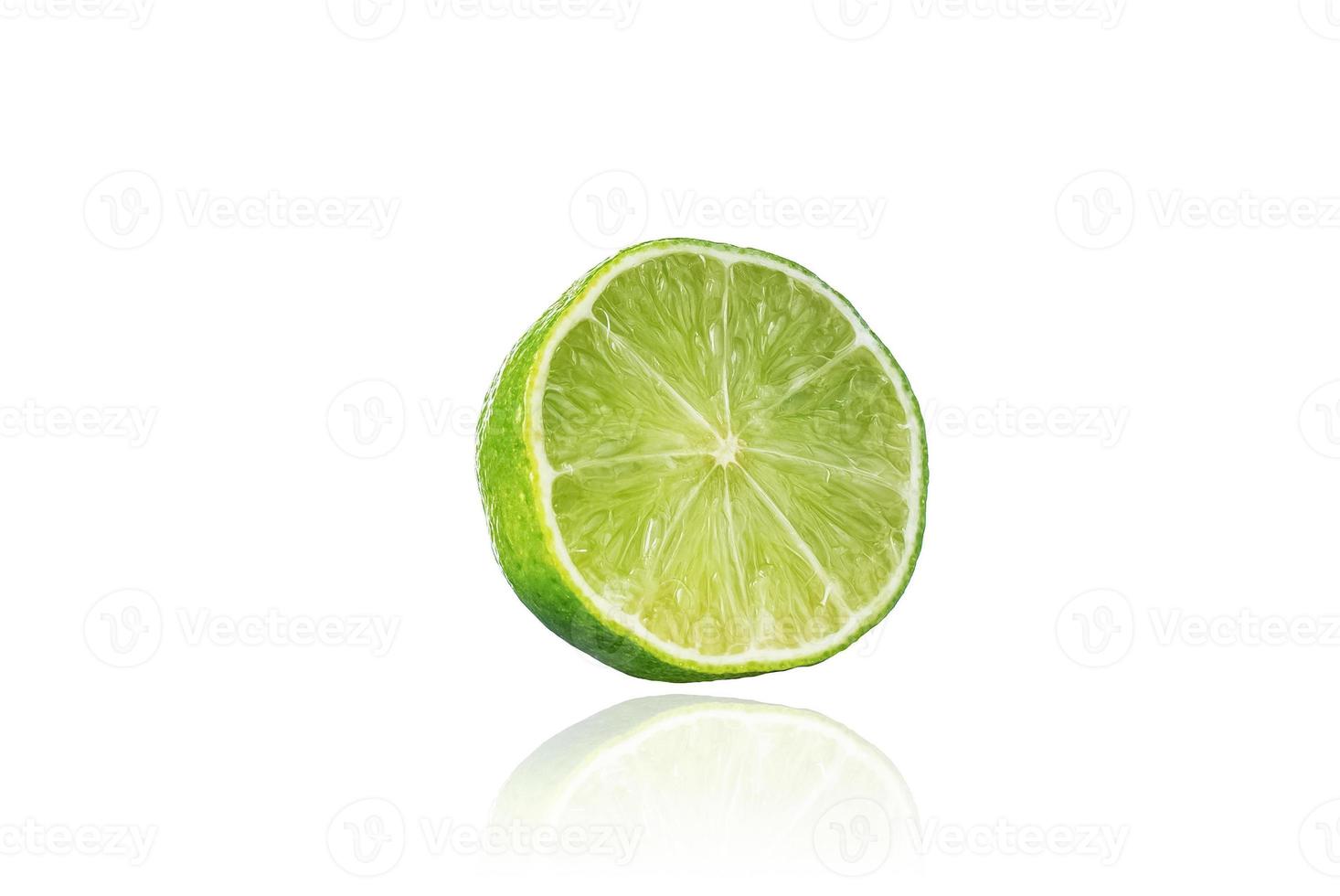 Piece of lime, slice, isolated on white background with drop shadow. photo