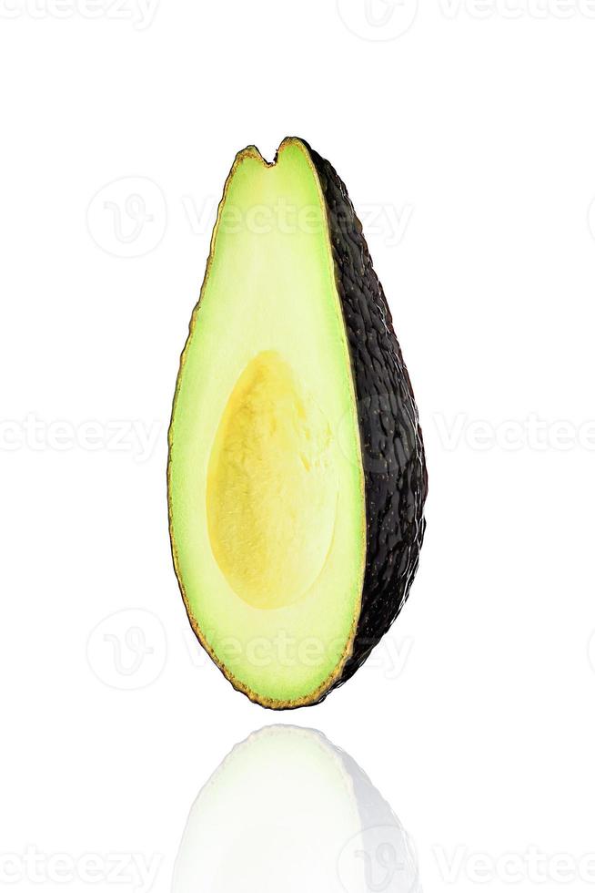 Half of Avocado fruit, slice, isolated on white background with drop shadow. photo