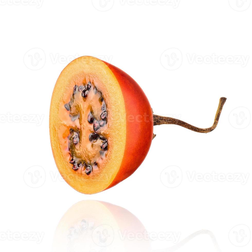 Half of Tamarillo fruit, slice, isolated on white background with drop shadow. photo