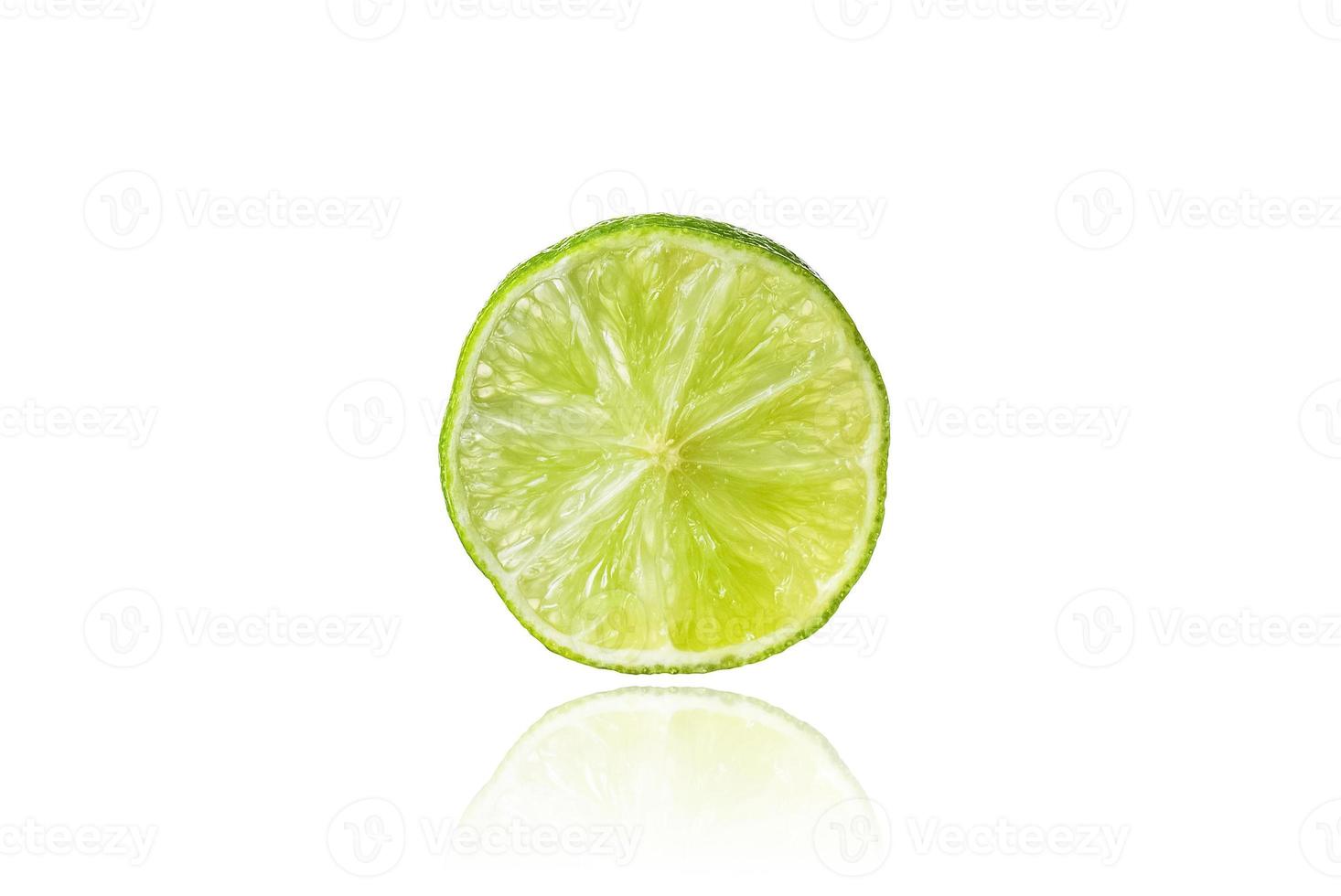 Piece of lime, slice, isolated on white background with drop shadow. photo