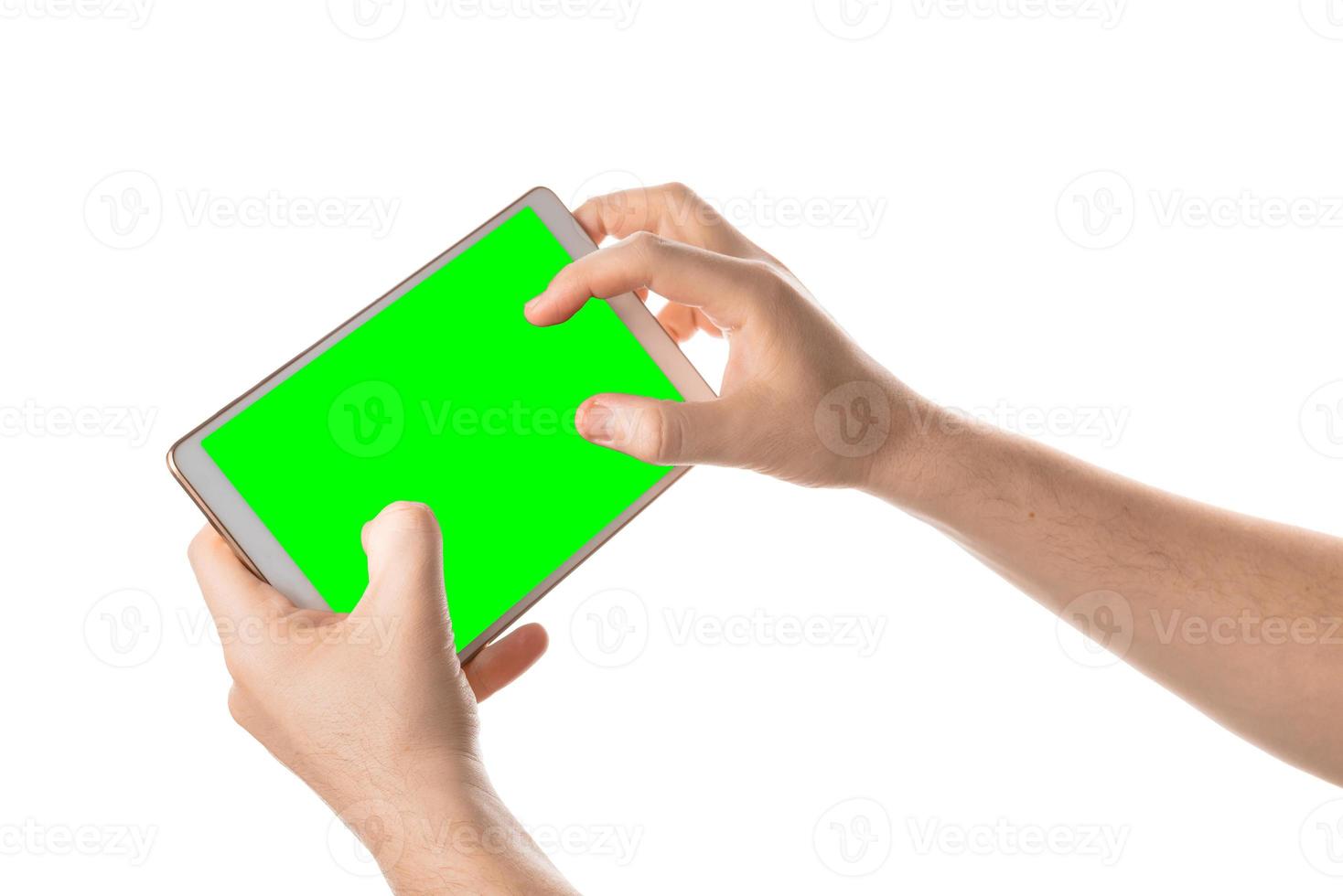Man hold and touching the blank screen on the white tablet. Isolated screen with chroma key and all isolated on white background. photo
