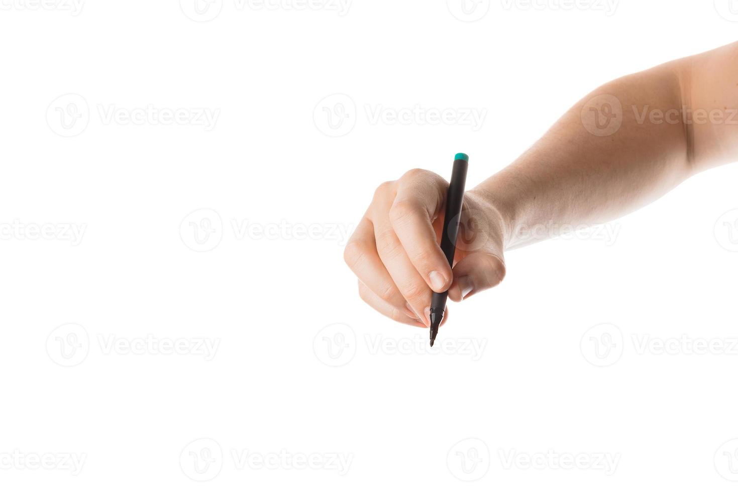 Male hand writing with the marker or felt pen. Isolated on white background. photo