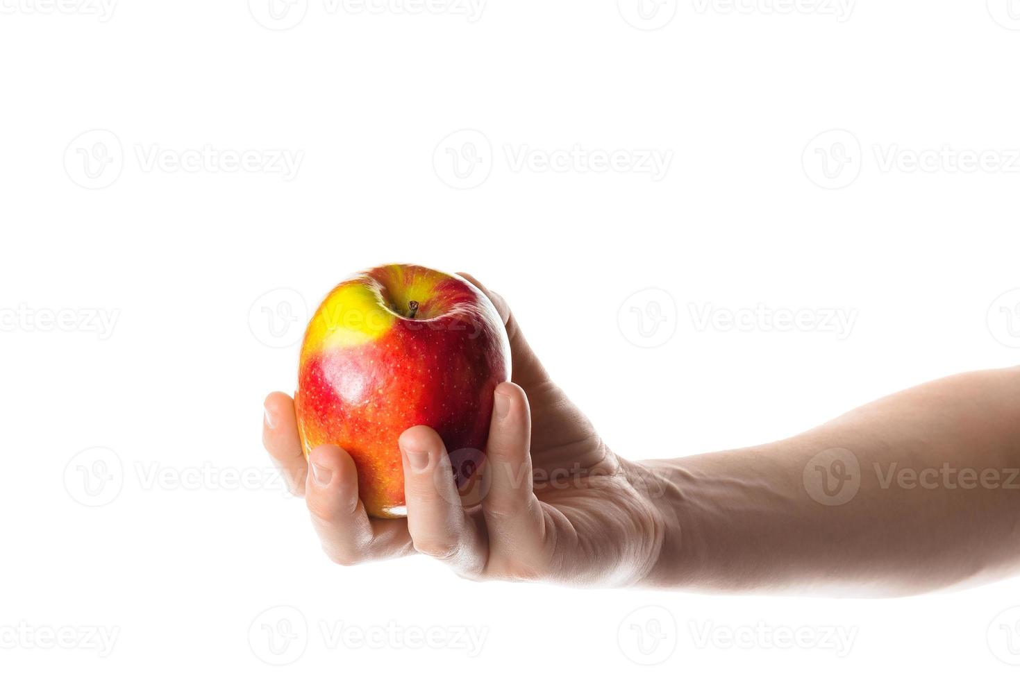 Man holding one red apple in his hand. Isolated on white background. photo