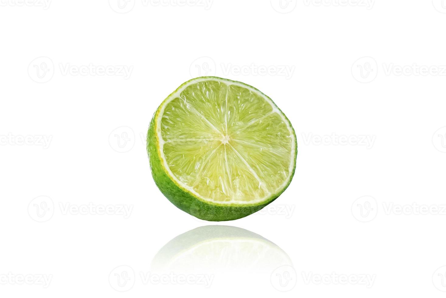 Piece of lime, slice, isolated on white background with drop shadow. photo