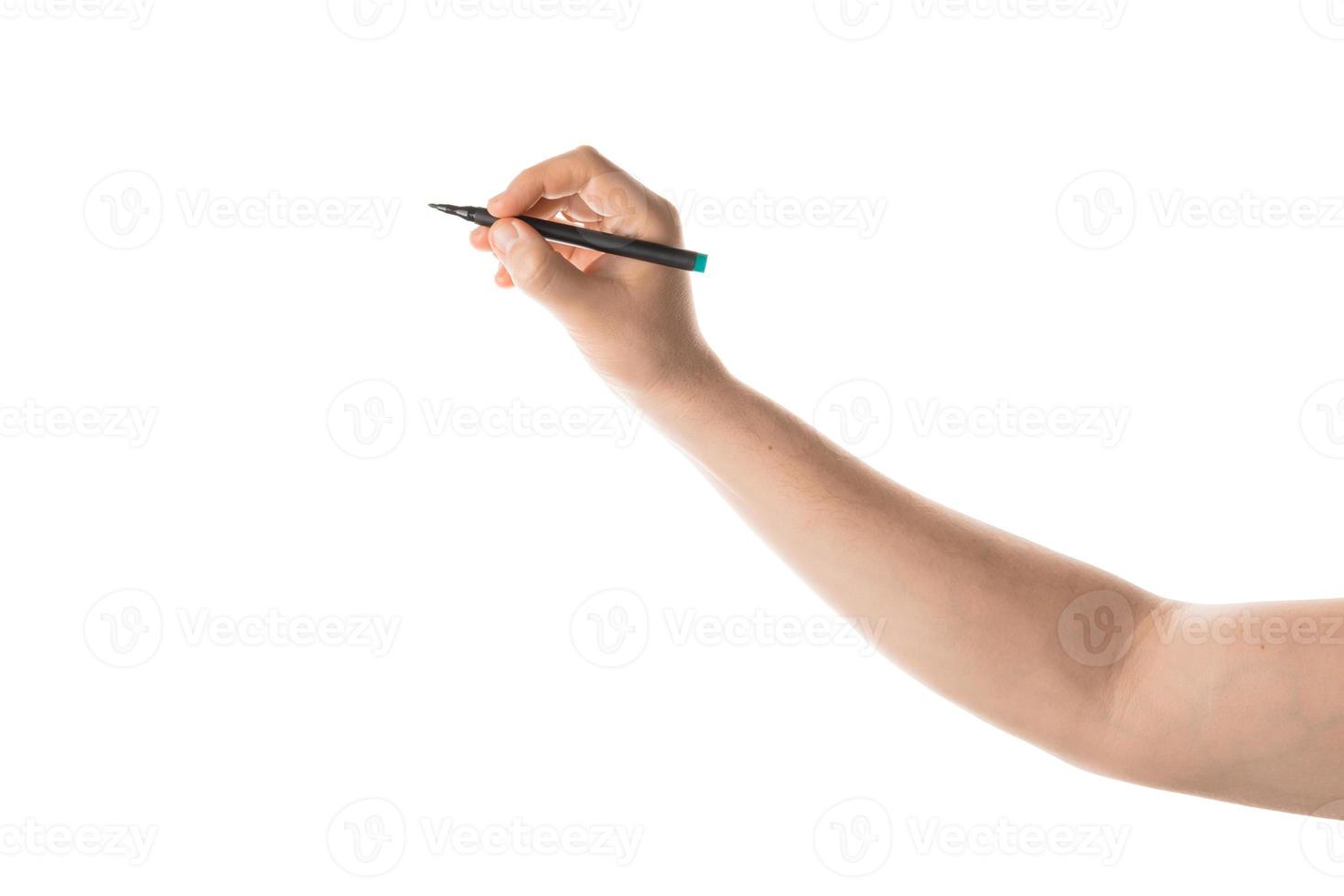 Male hand writing with the marker or felt pen. Isolated on white background. photo