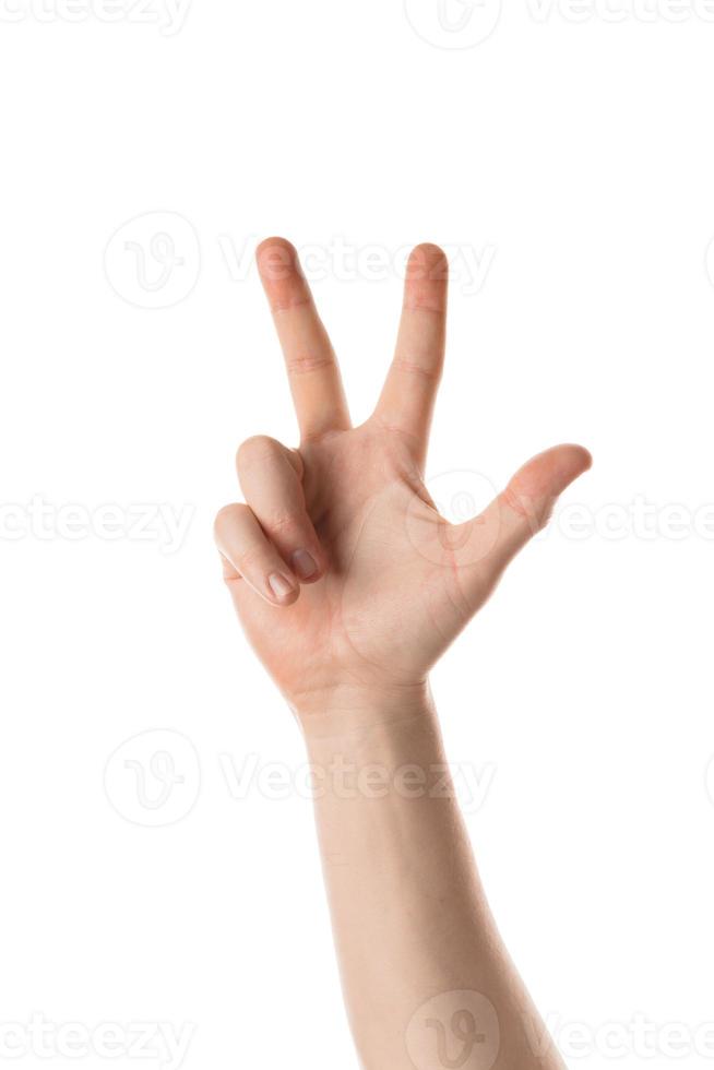 Man showing a numbers with a hand gesture. Isolated on white background. photo