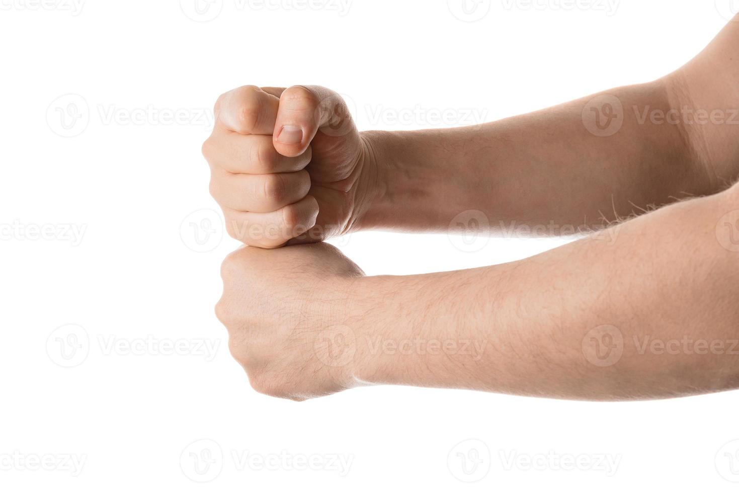 Man hold his fists together, hand gesture. Isolated on white background. photo