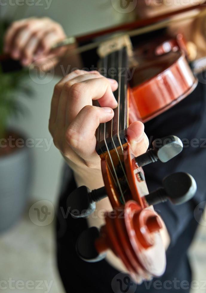 Classical player hands, details of violin playing photo