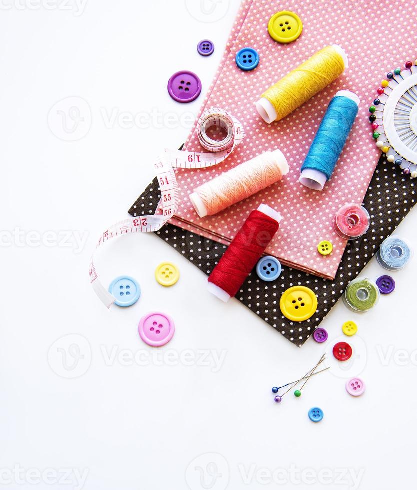 Sewing accessories on a white background photo