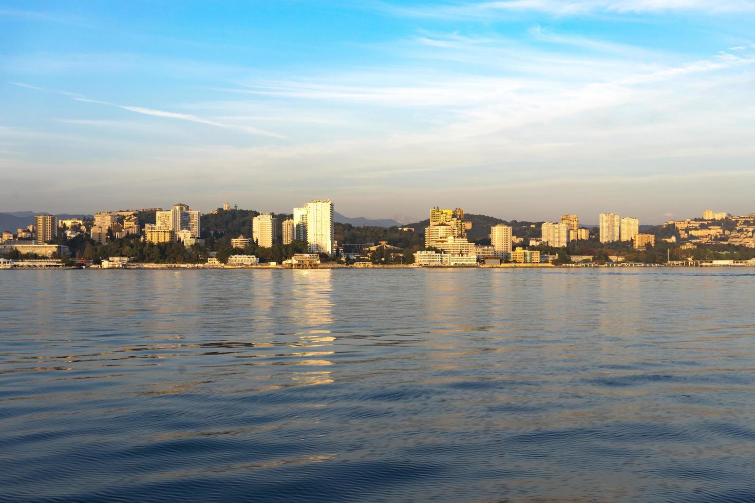 Sea view of the city skyline with modern buildings photo