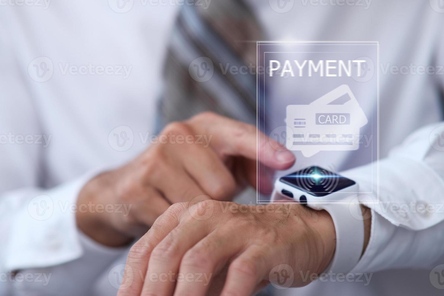 Businessman using smart watch making online payment, using smart watch for shopping photo