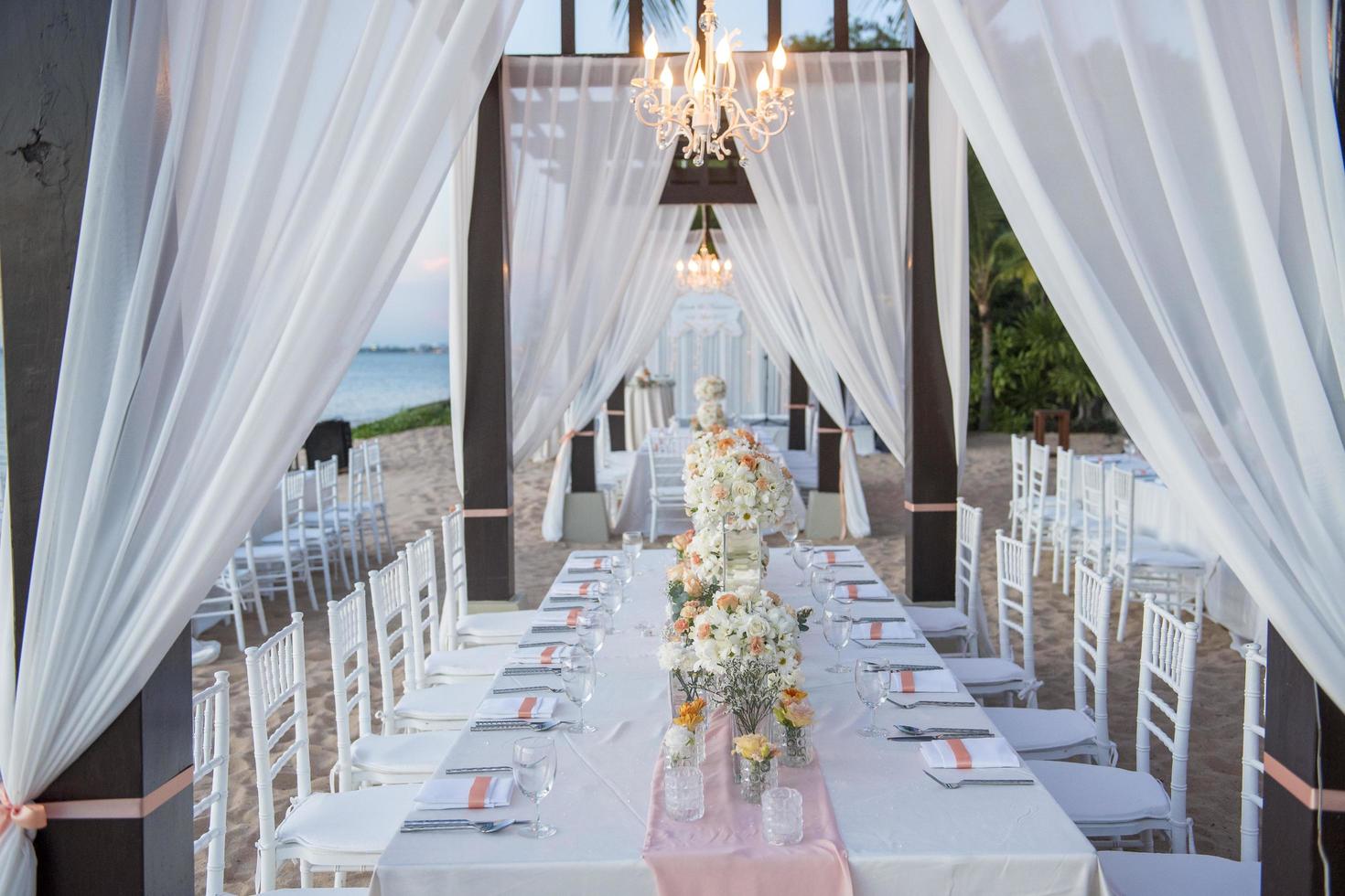 The elegant dinner table on the beach photo
