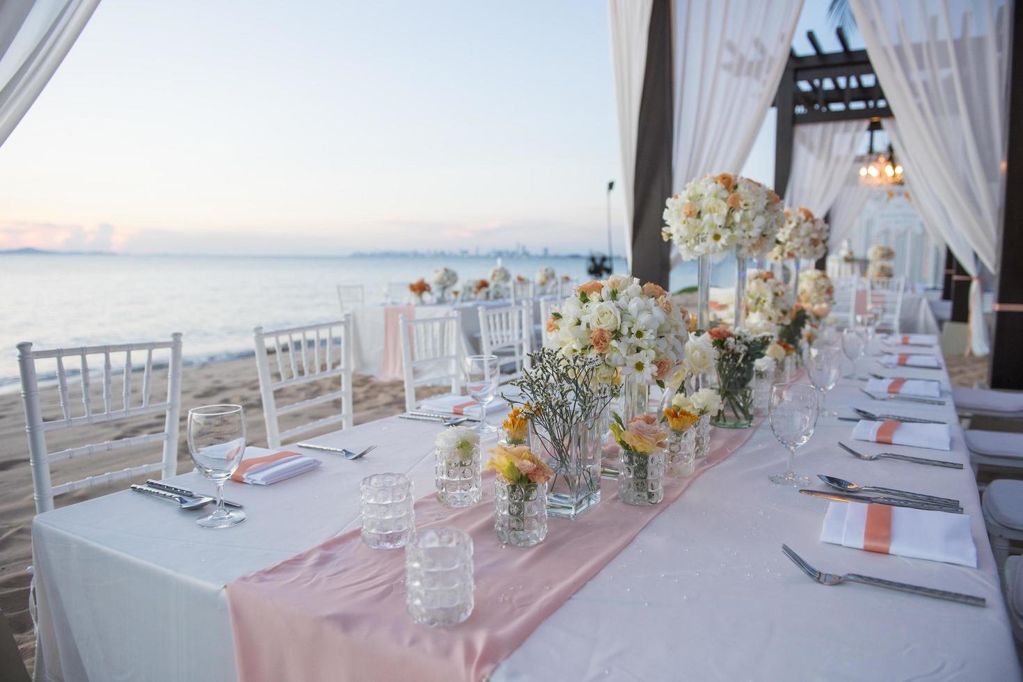 The elegant dinner table on the beach photo