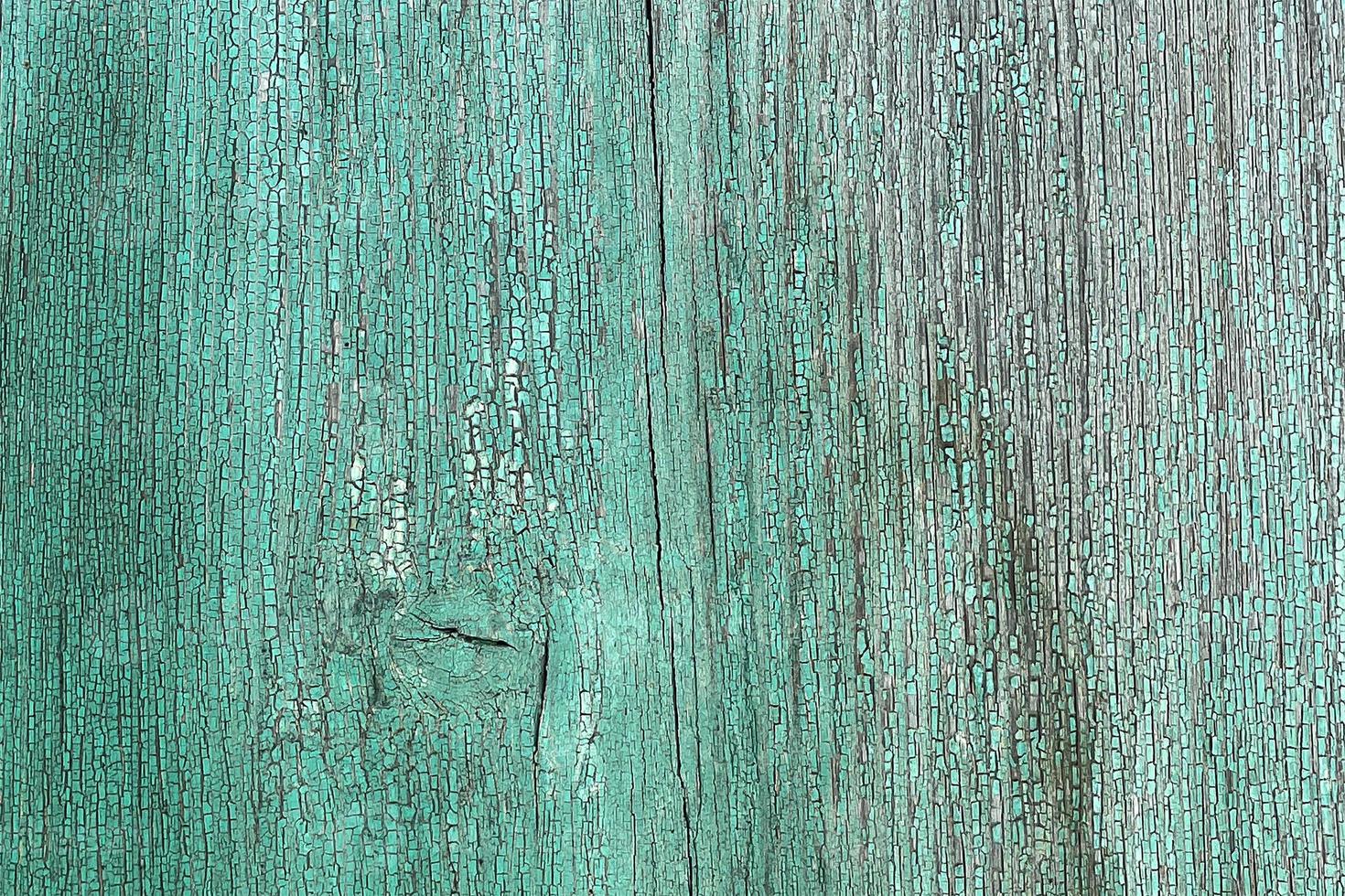 pared de tablones de madera de color azul con grietas. fondo para el diseño foto