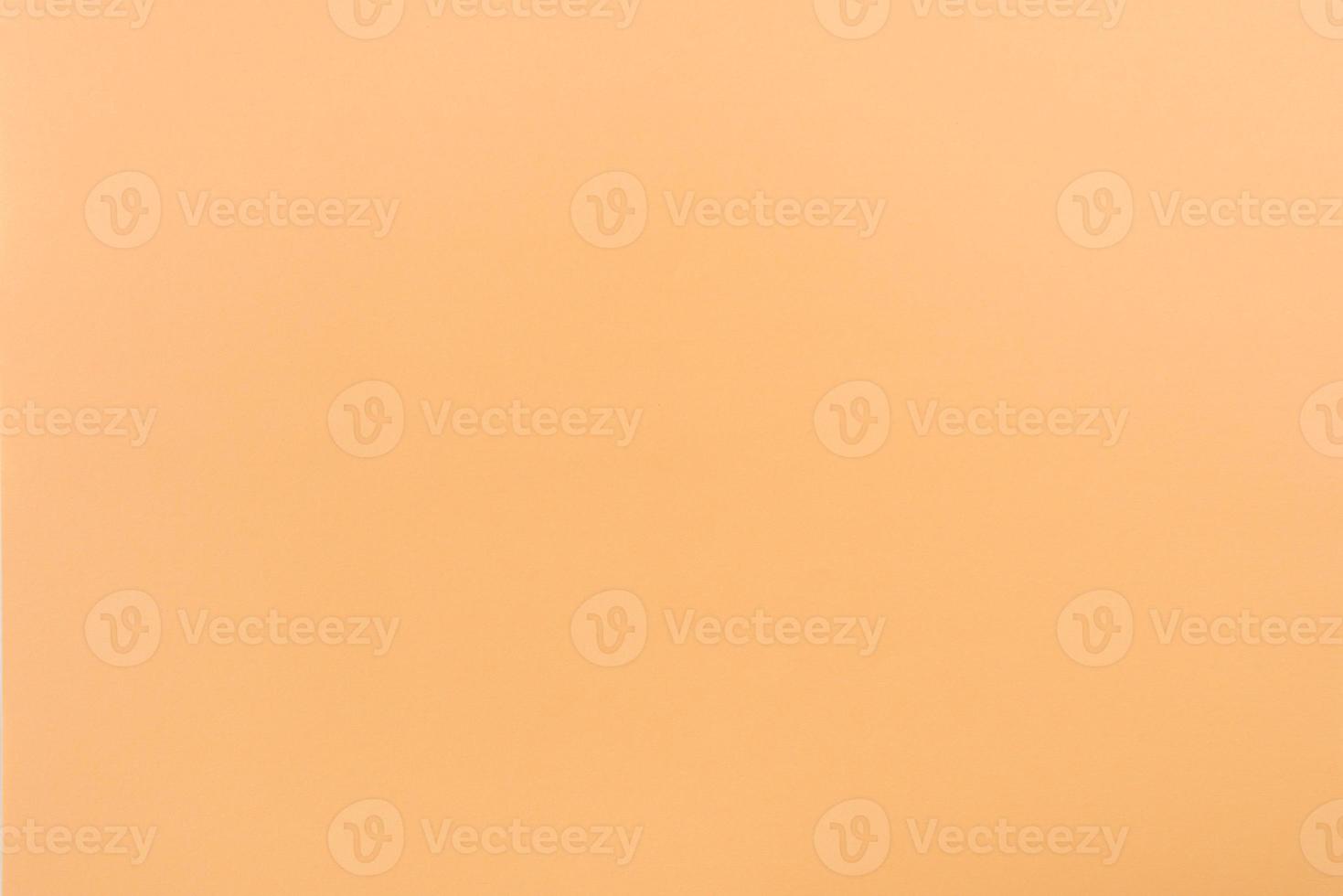 Orange paper with soft texture. Simple background. photo