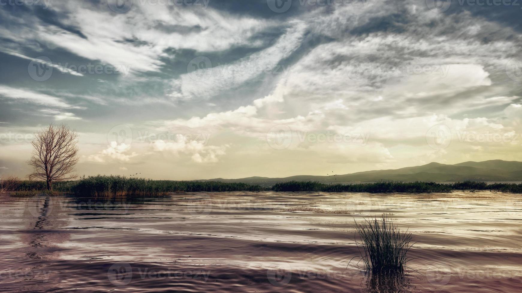 Tranquil evening at lake. Sunset at Dojran lake, FYR Macedonia. South Macedonia. photo