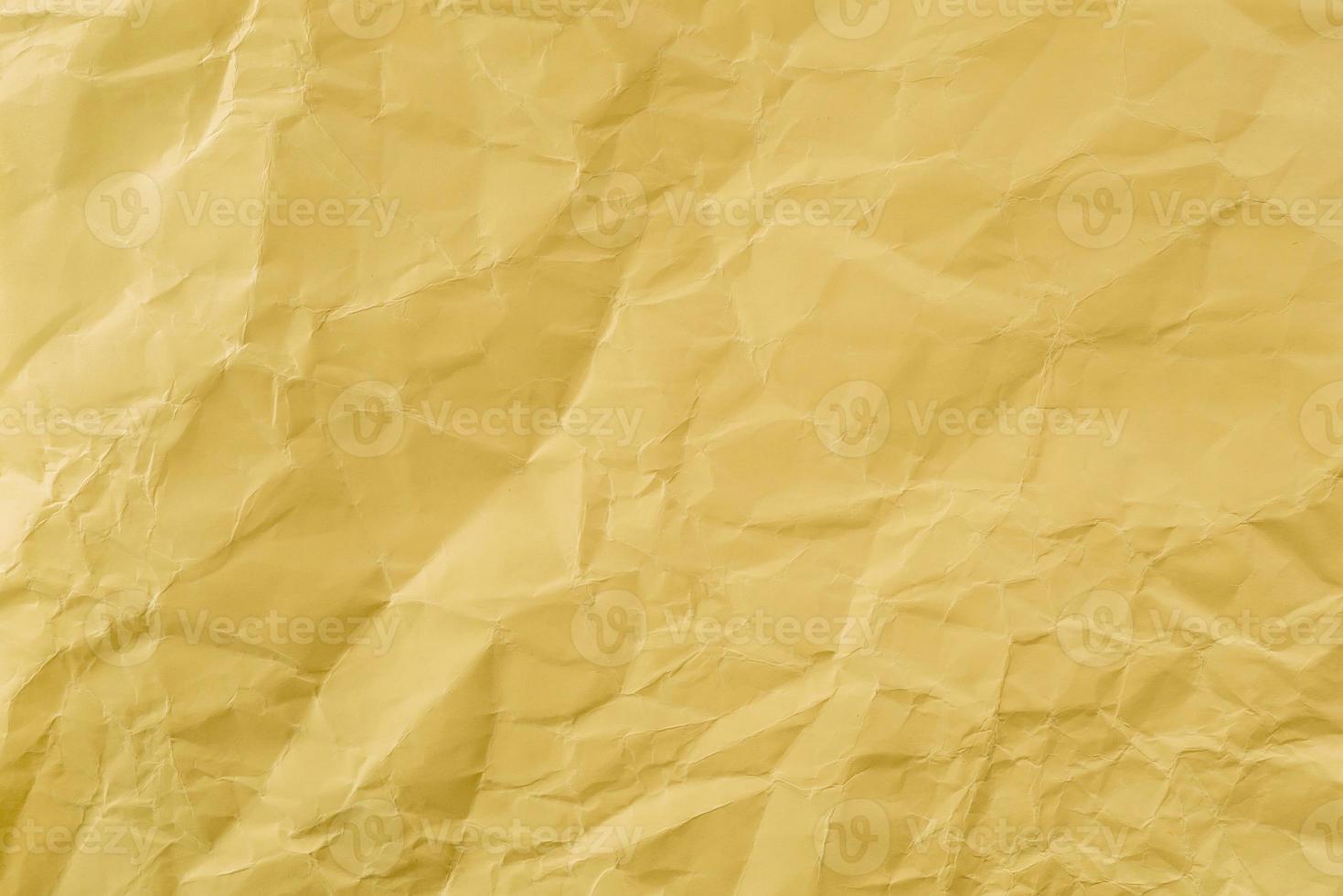 Crumpled Yellow paper with soft texture. Simple background. photo