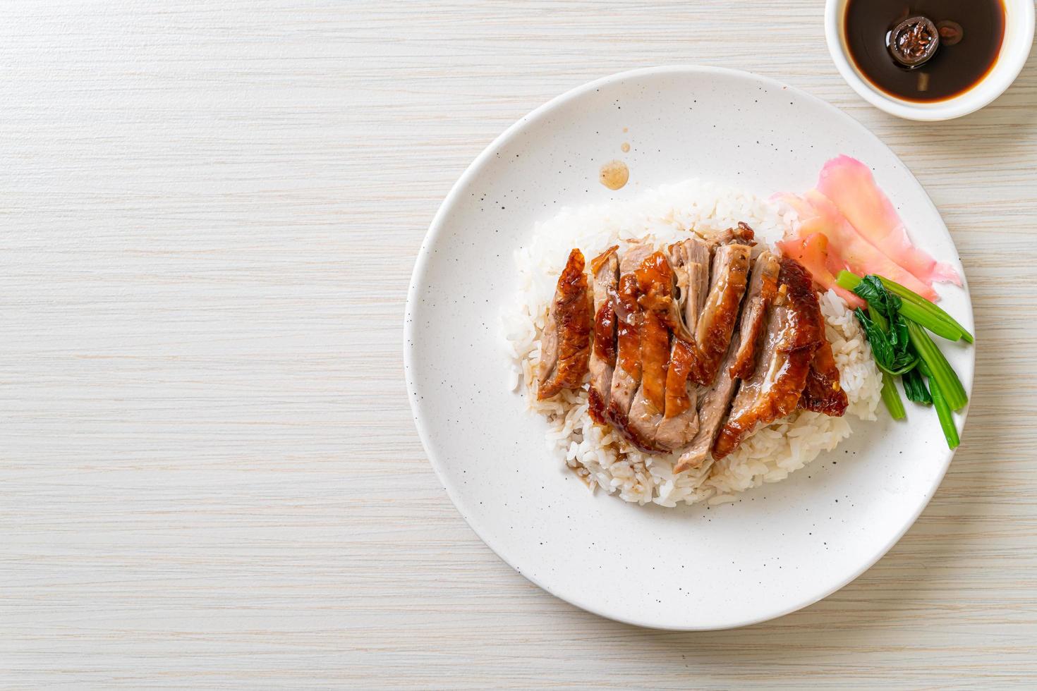 Roasted duck on rice photo