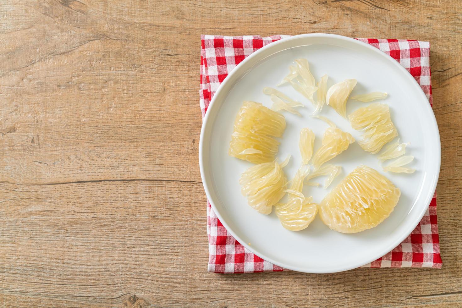 Fresh peeled pomelo, grapefruit or shaddock photo
