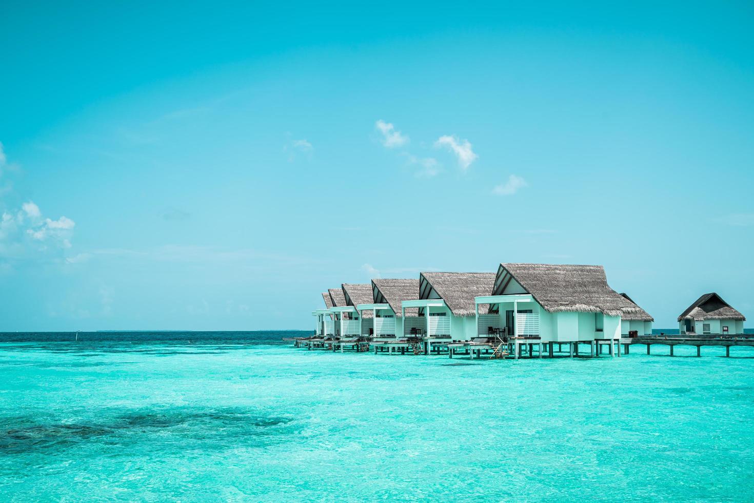 Beautiful tropical Maldives resort hotel and island with beach and sea photo