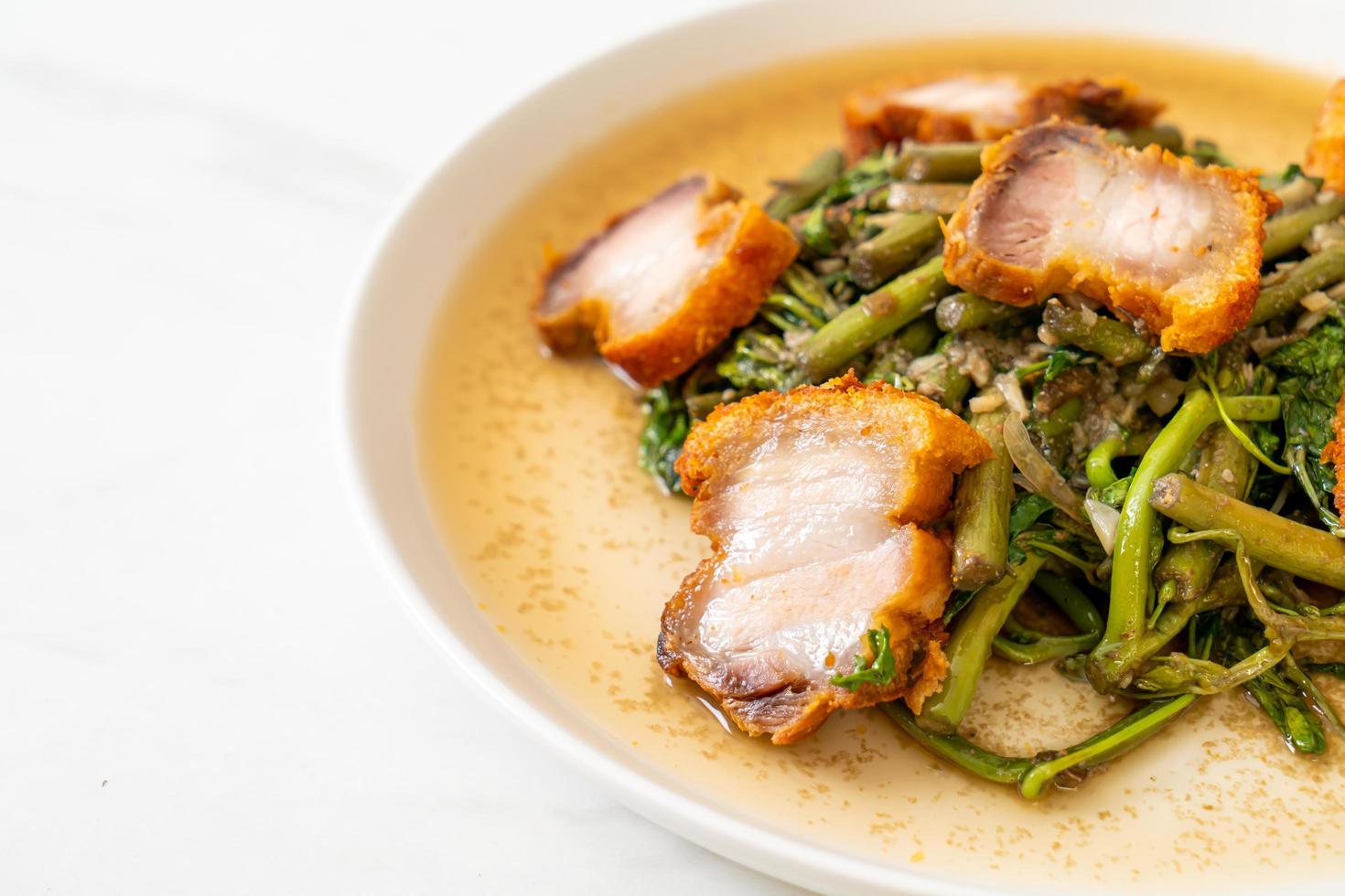 Stir-fried water mimosa with crispy pork belly photo