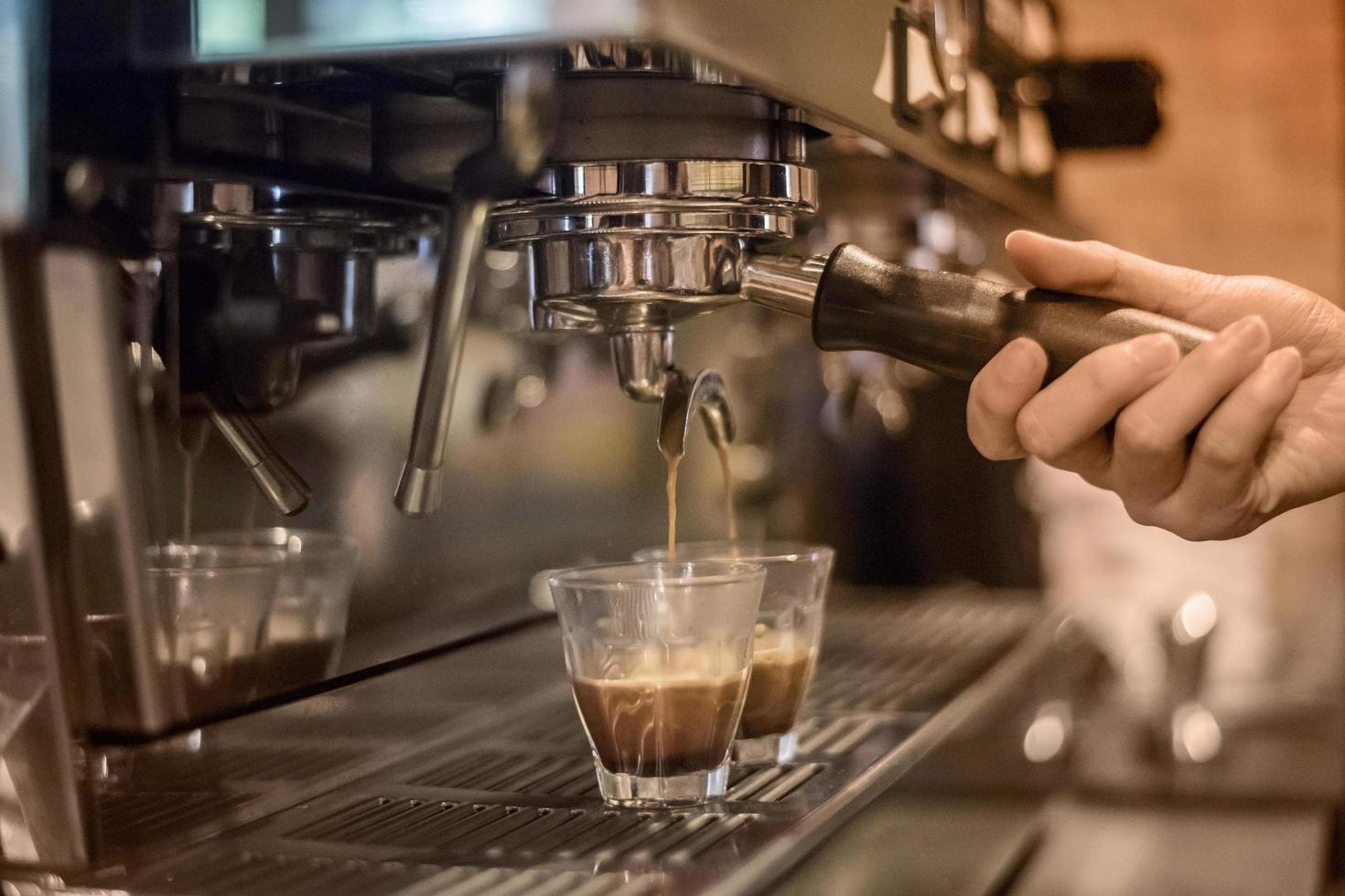Barista making espresso drinks 2629193 Stock Photo at Vecteezy