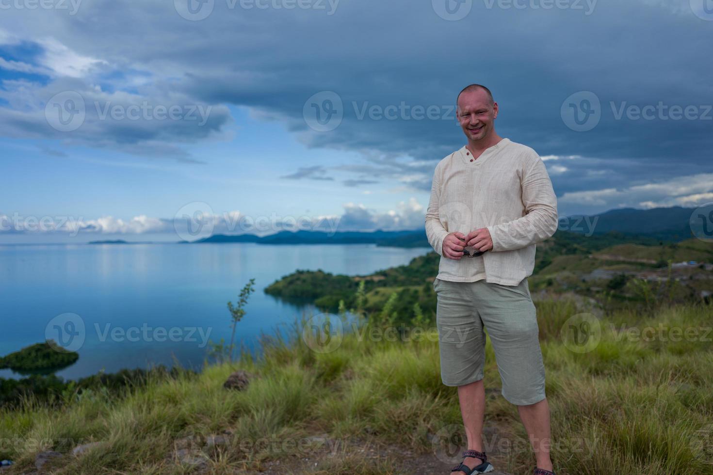 Caucasian man in front of Labuan Bajo Sea photo