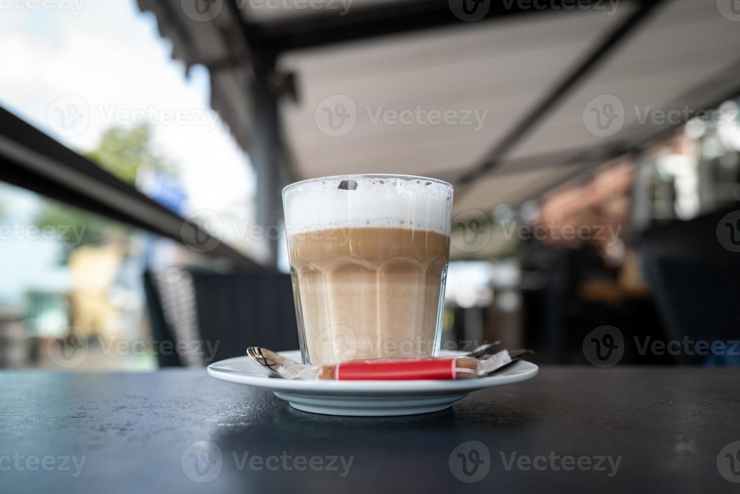 A glass of coffee with milk photo