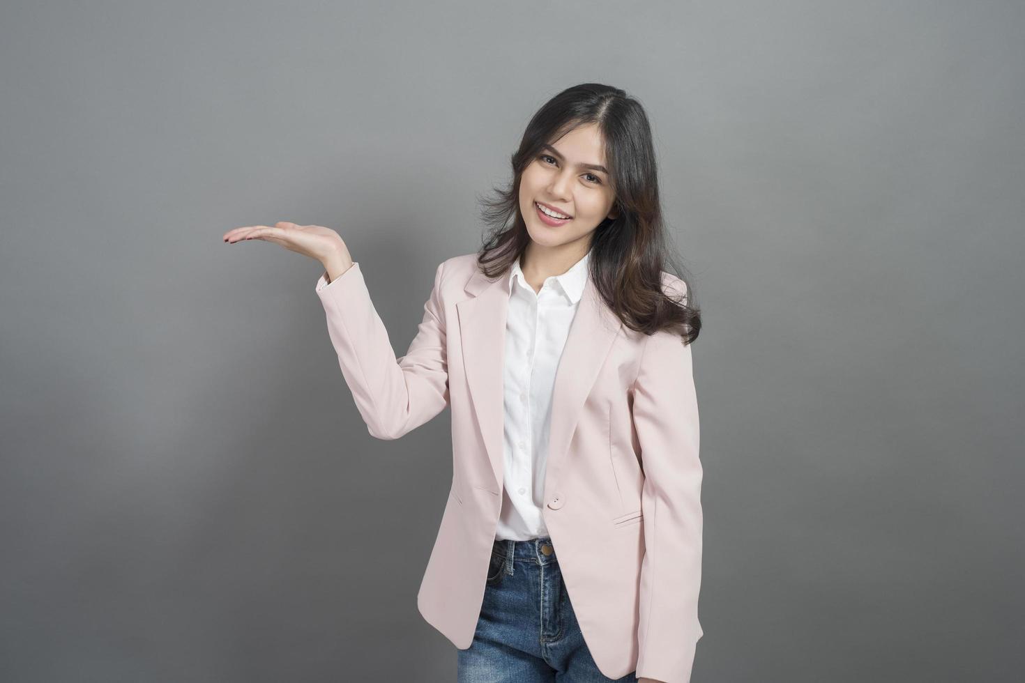 Asian businesswoman are smart, portrait in studio grey background photo