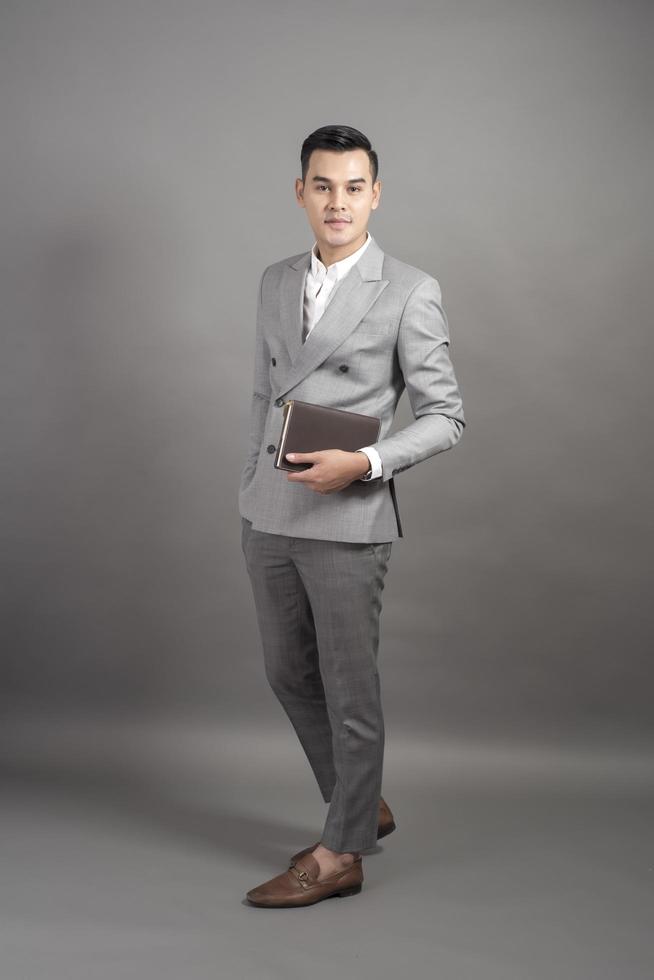 Businessman is smart portrait in studio grey background photo