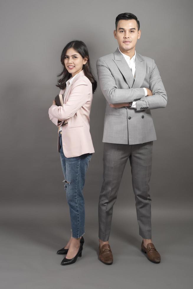 Businessman and businesswoman are smart portrait in studio photo