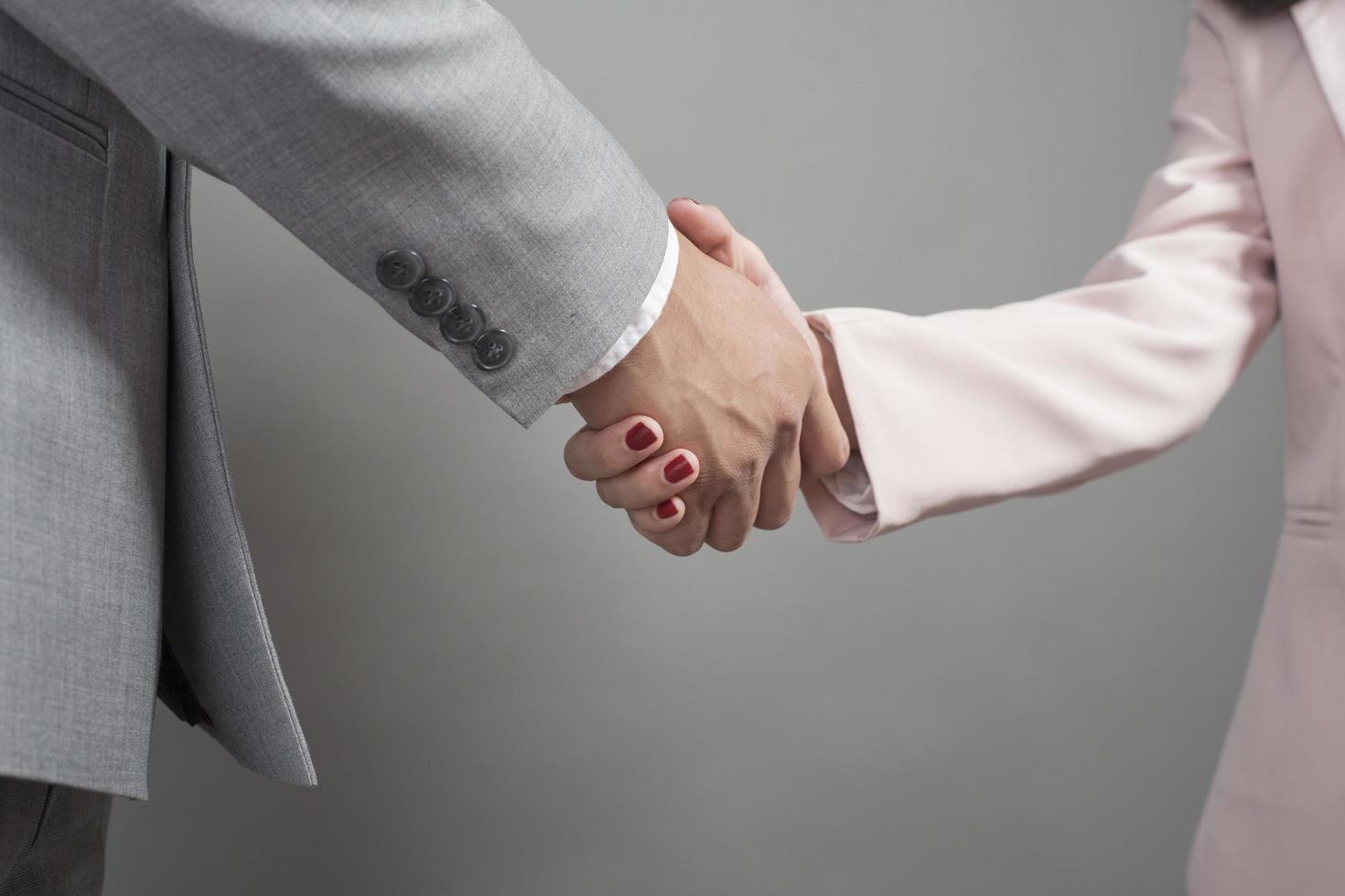 Businessman and businesswoman are shaking hands,Business plan and business meeting concept photo