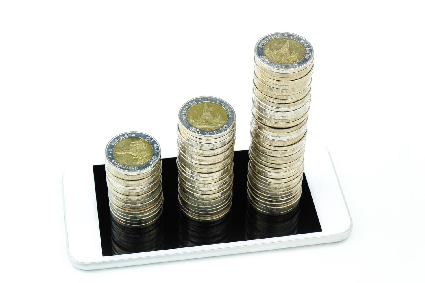 A coin stack growth increase on smart phone. Business concept. photo