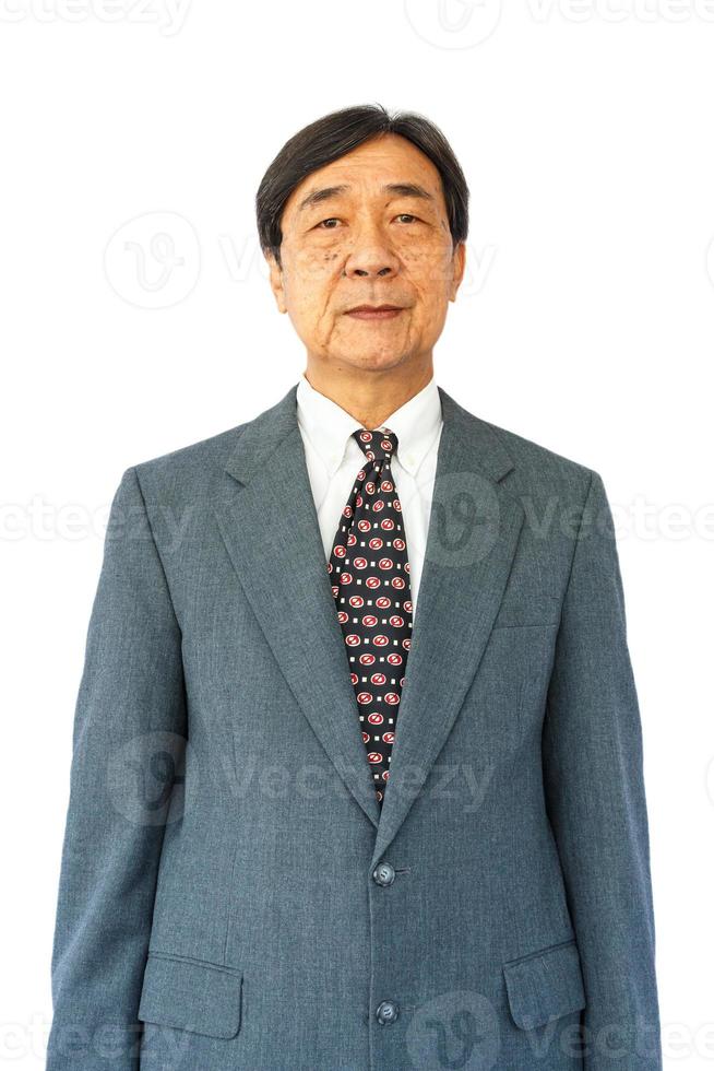 old aged thai businessman is standing and looking on white background  isolated photo
