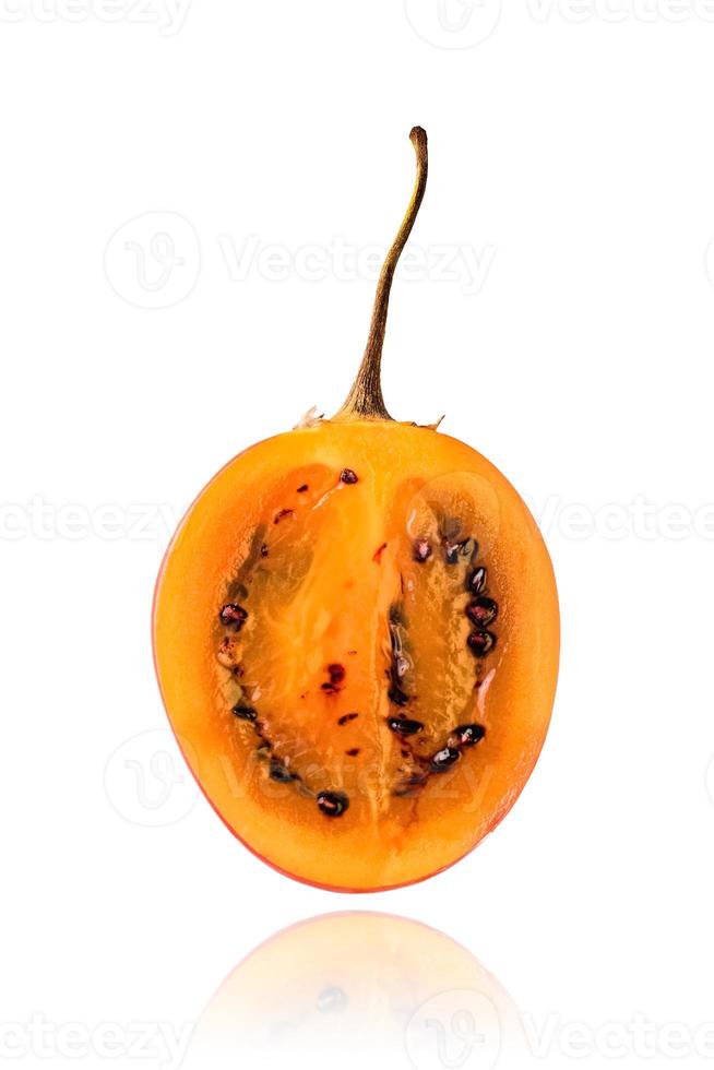 Half of Tamarillo fruit, slice, isolated on white background with drop shadow. photo
