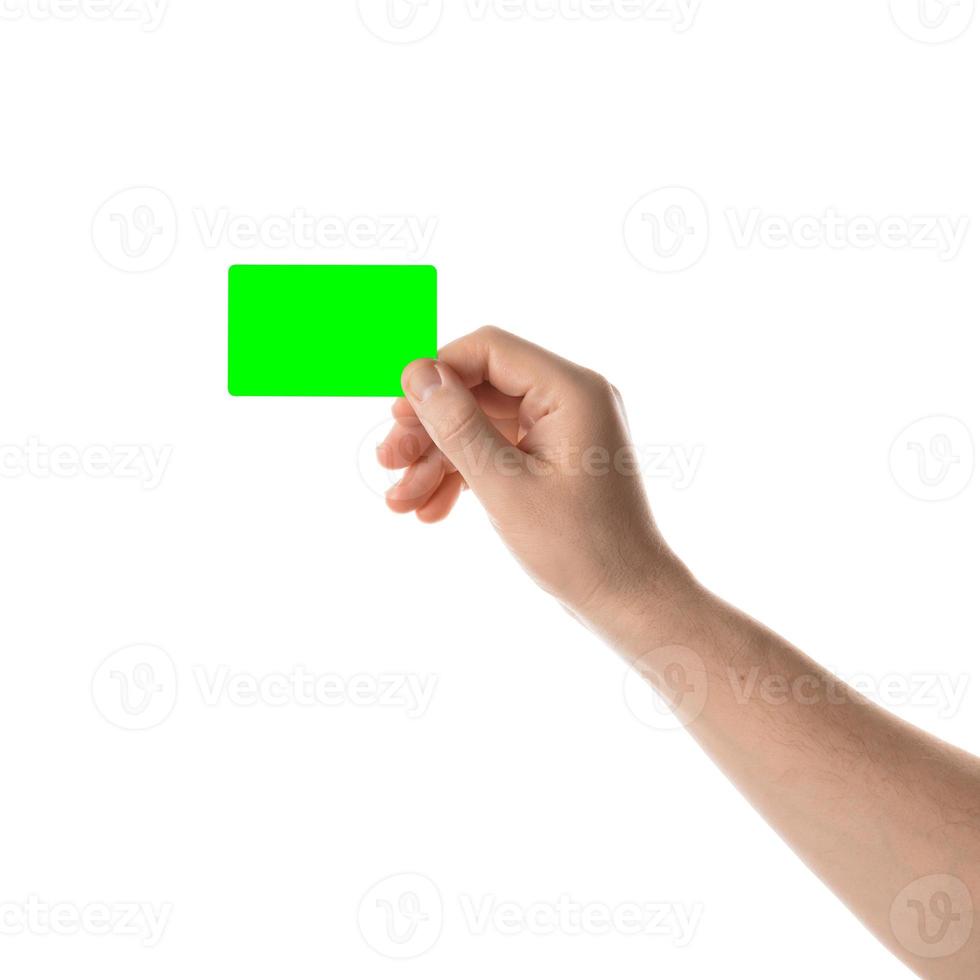 Male hand holds a credit card or business card. Isolated with chroma key and all isolated on white background. photo