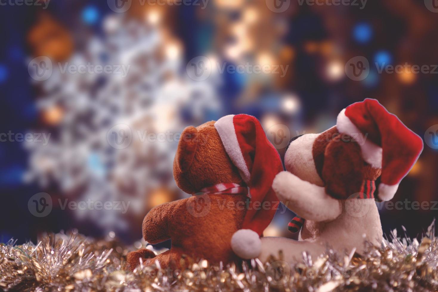 Two teddy bears enjoying Christmas and New Year Eve, New Year celebration concept. photo