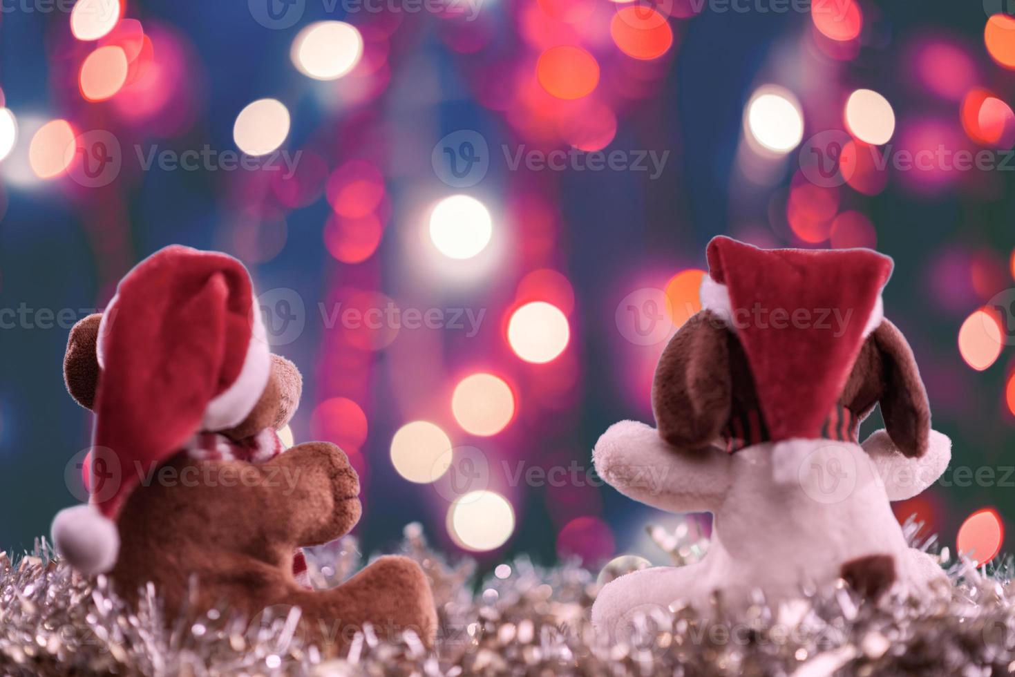 Two teddy bears enjoying Christmas and New Year Eve, New Year celebration concept. photo