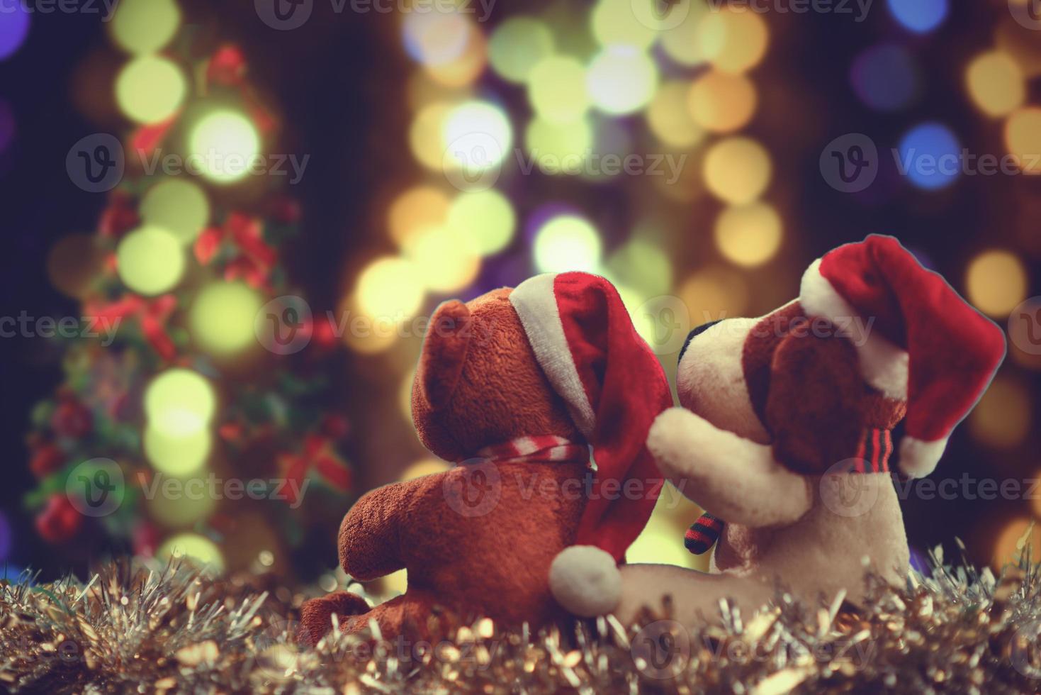 Two teddy bears enjoying Christmas and New Year Eve, New Year celebration concept. photo