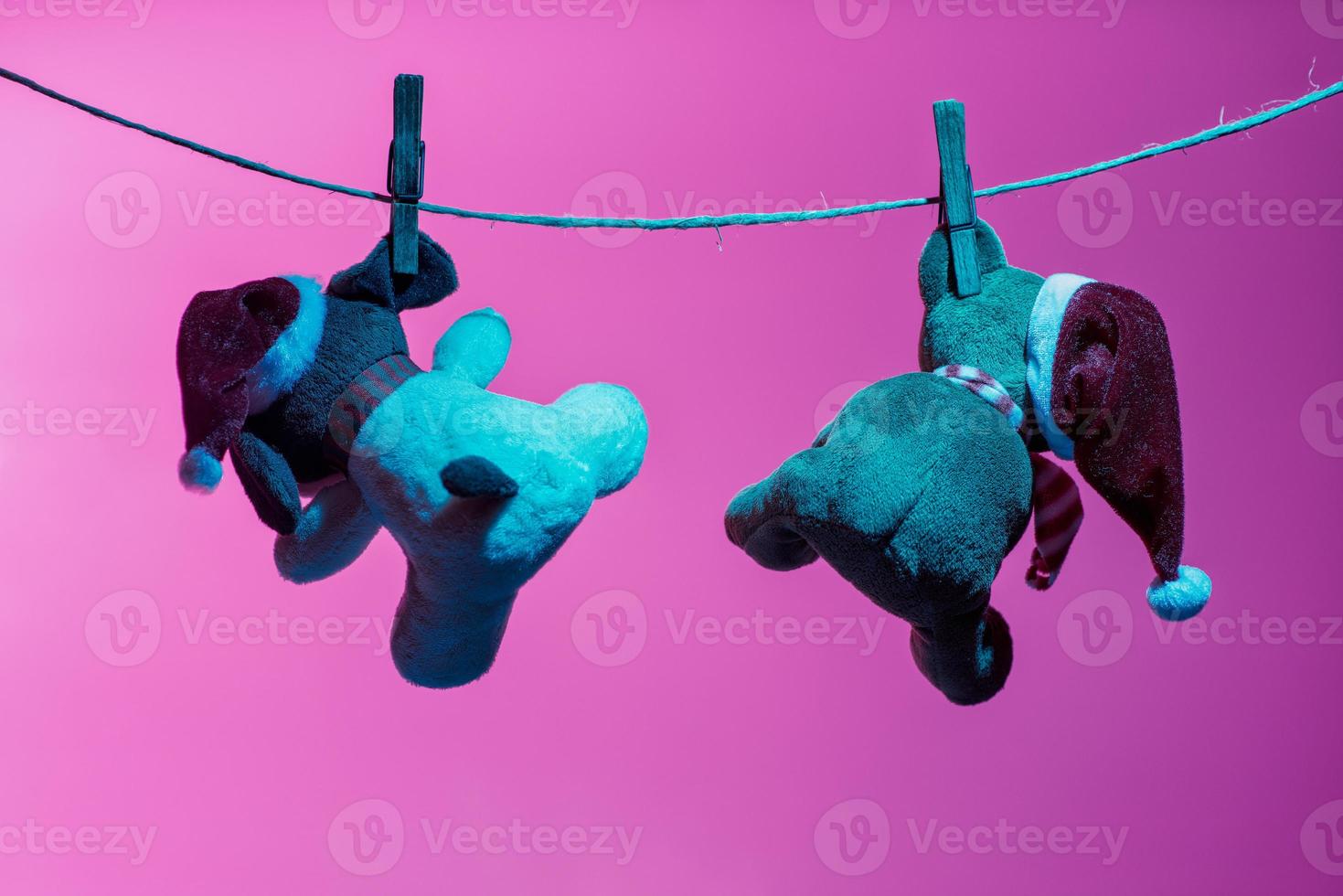 Two teddy bears enjoying Christmas and New Year Eve, New Year celebration concept. photo